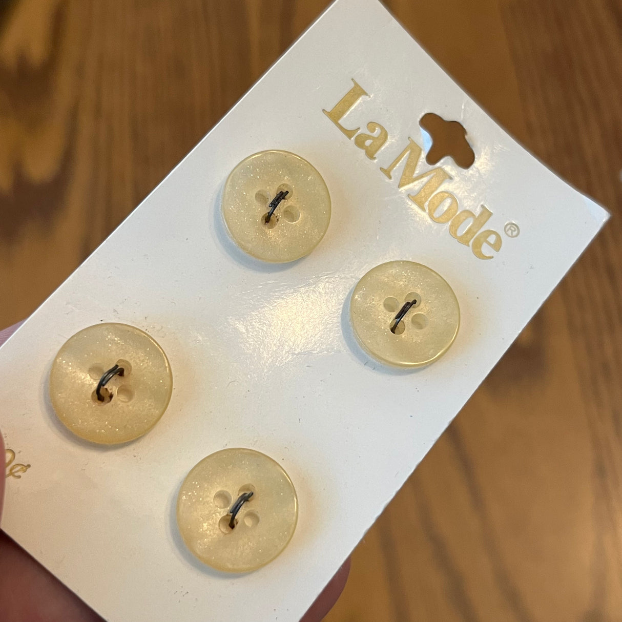 1980’s La Mode Plastic Buttons - Cream color with glitter inside - Set of 4 - Size 23 - 5/8" - on card