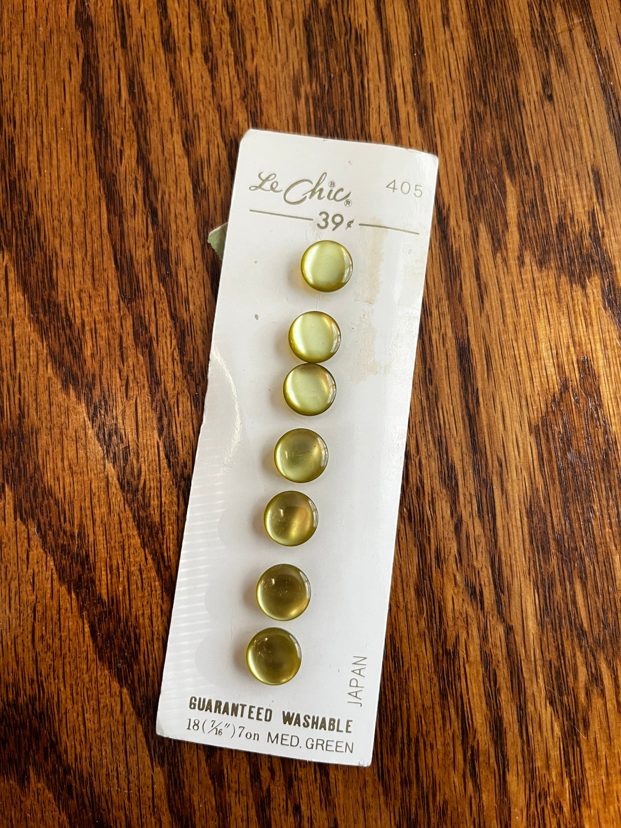 1980’s Le Chic Medium Green Pearlescent Plastic Rounded Top Shank Buttons - Set of 7 - 7/16" - on card