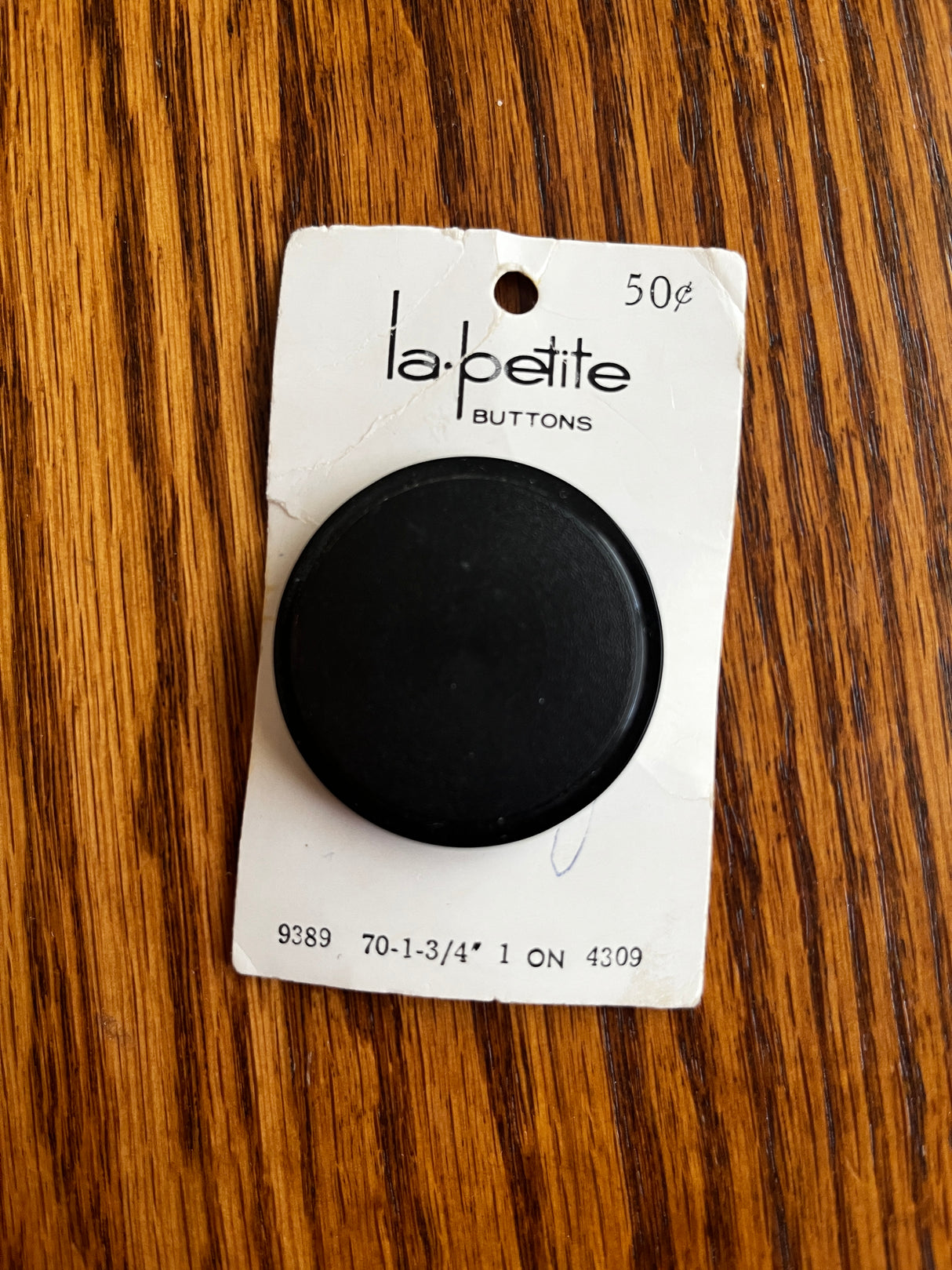 1980’s La Petite Large Black Matte Plastic Shank Button - Set of 1 - 1 3/4” - on card