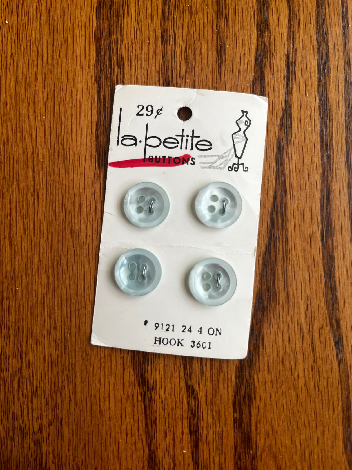 1980’s La Petite Light Blue Pearlescent Plastic Button - Set of 4 - 5/8” - on card
