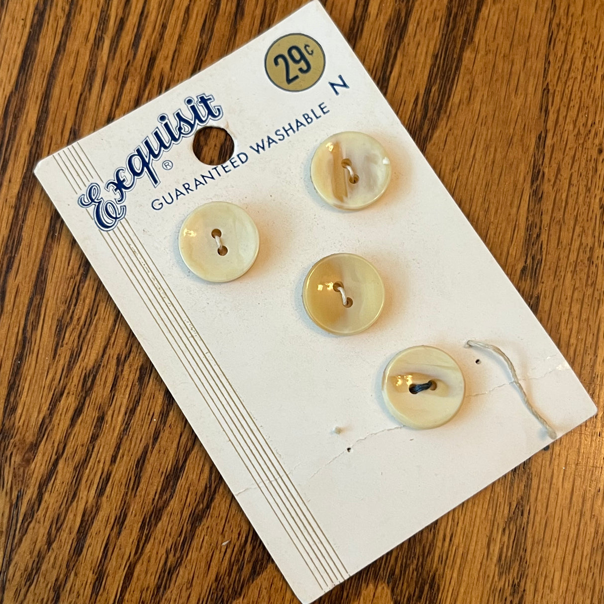 1970’s Exquisit Shell Buttons - Cream - Set of 4 - 5/8” - on cardi