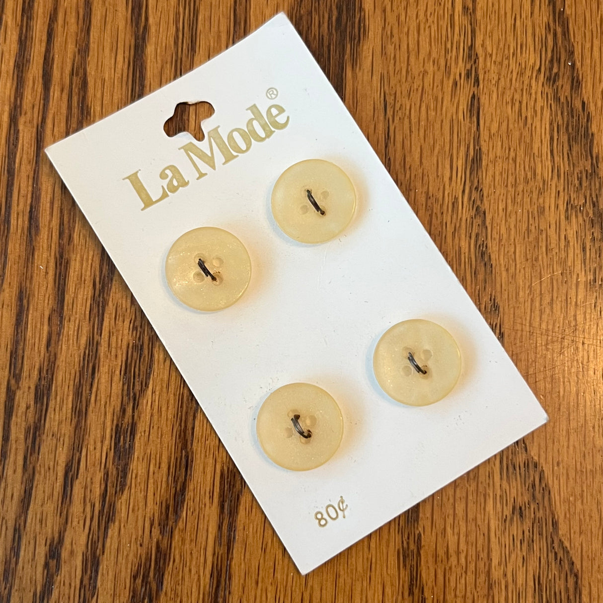 1980’s La Mode Plastic Buttons - Cream color with glitter inside - Set of 4 - Size 23 - 5/8" - on card