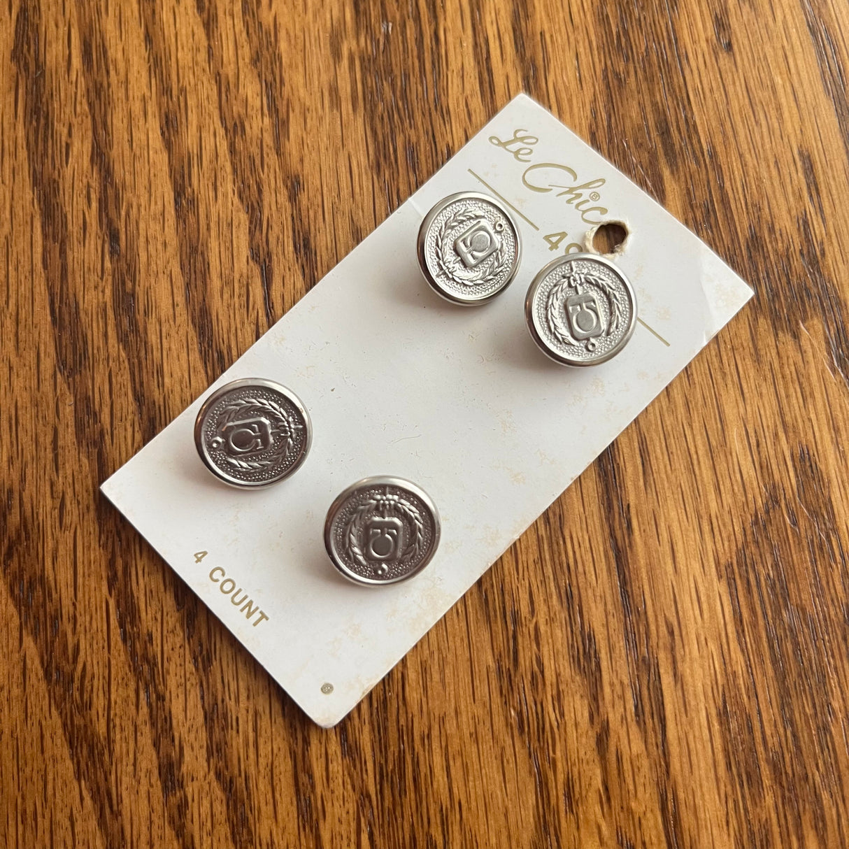 1970’s Le Chic Omega and Wheat Symbol Metal Buttons - Silver tone - 5/8" - on card