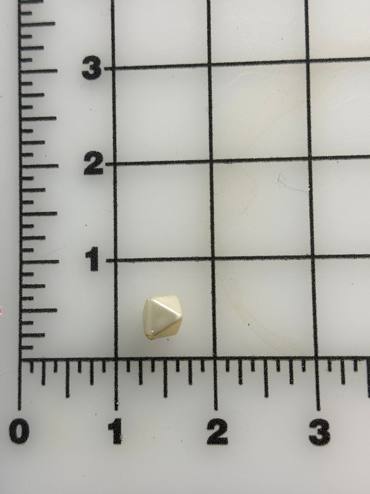 1980’s Cream Pearlescent Plastic Faceted Bicone beads