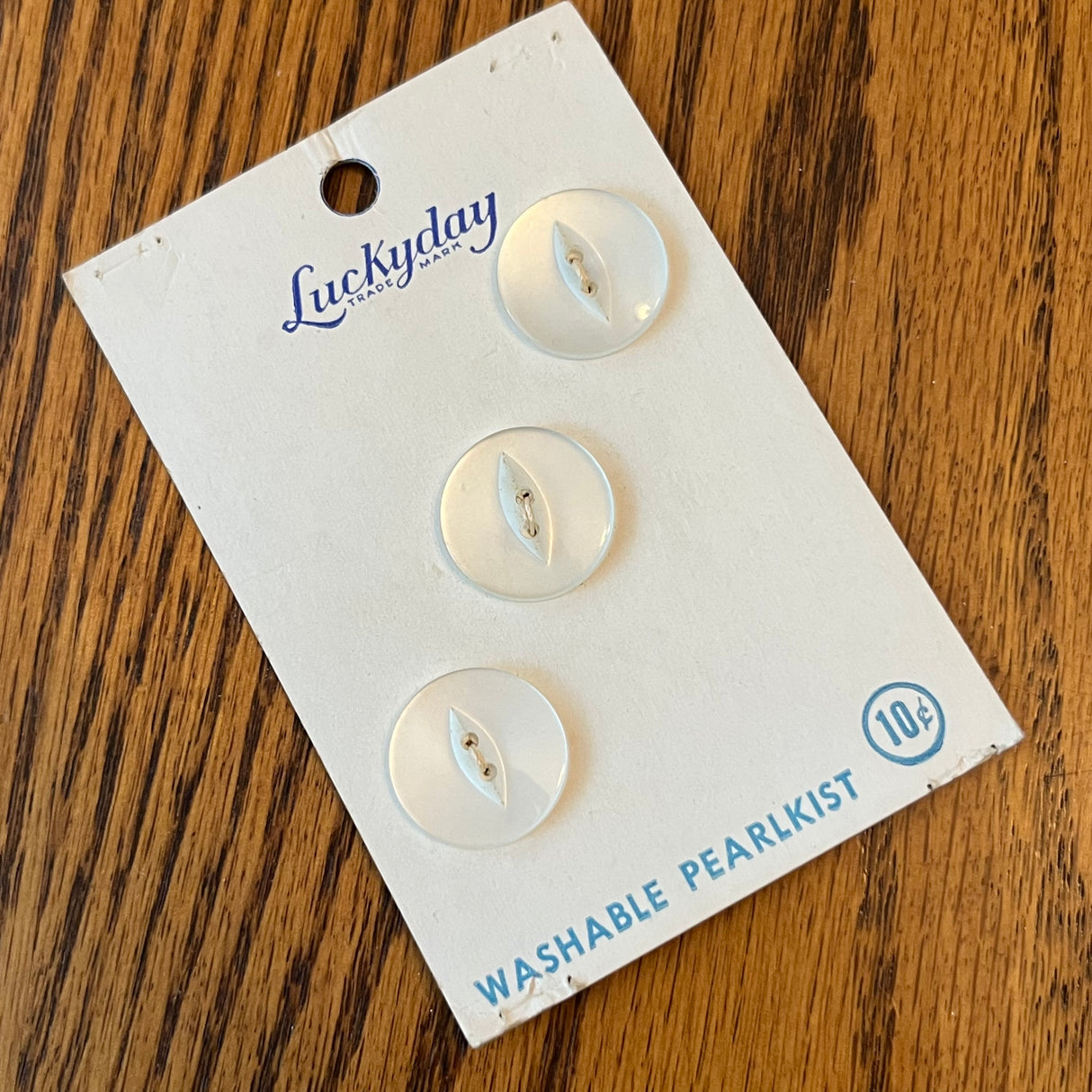 1950’s Lucky Day formed Plastic Buttons - Pearlkist - 3/4” - on card