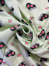 1990’s Pale Green Piano and Roses Novelty Print Cotton Jersey Knit Fabric - (P140)