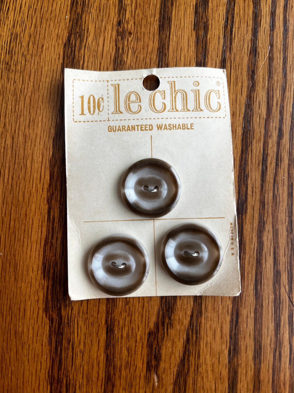 1960’s Le Chic Brown and White Plastic Buttons - set of 3 - on card