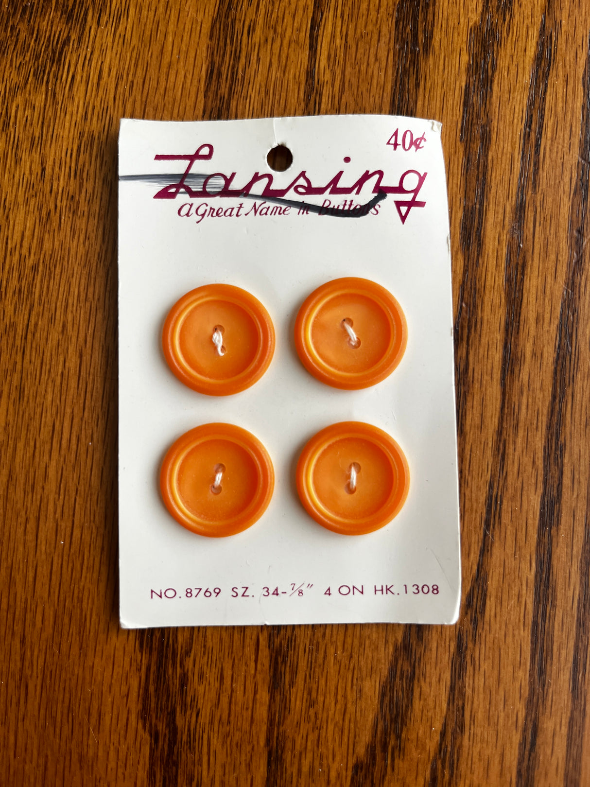 1970’s Lansing Light Orange Carved Plastic Buttons - set of 4 - on card